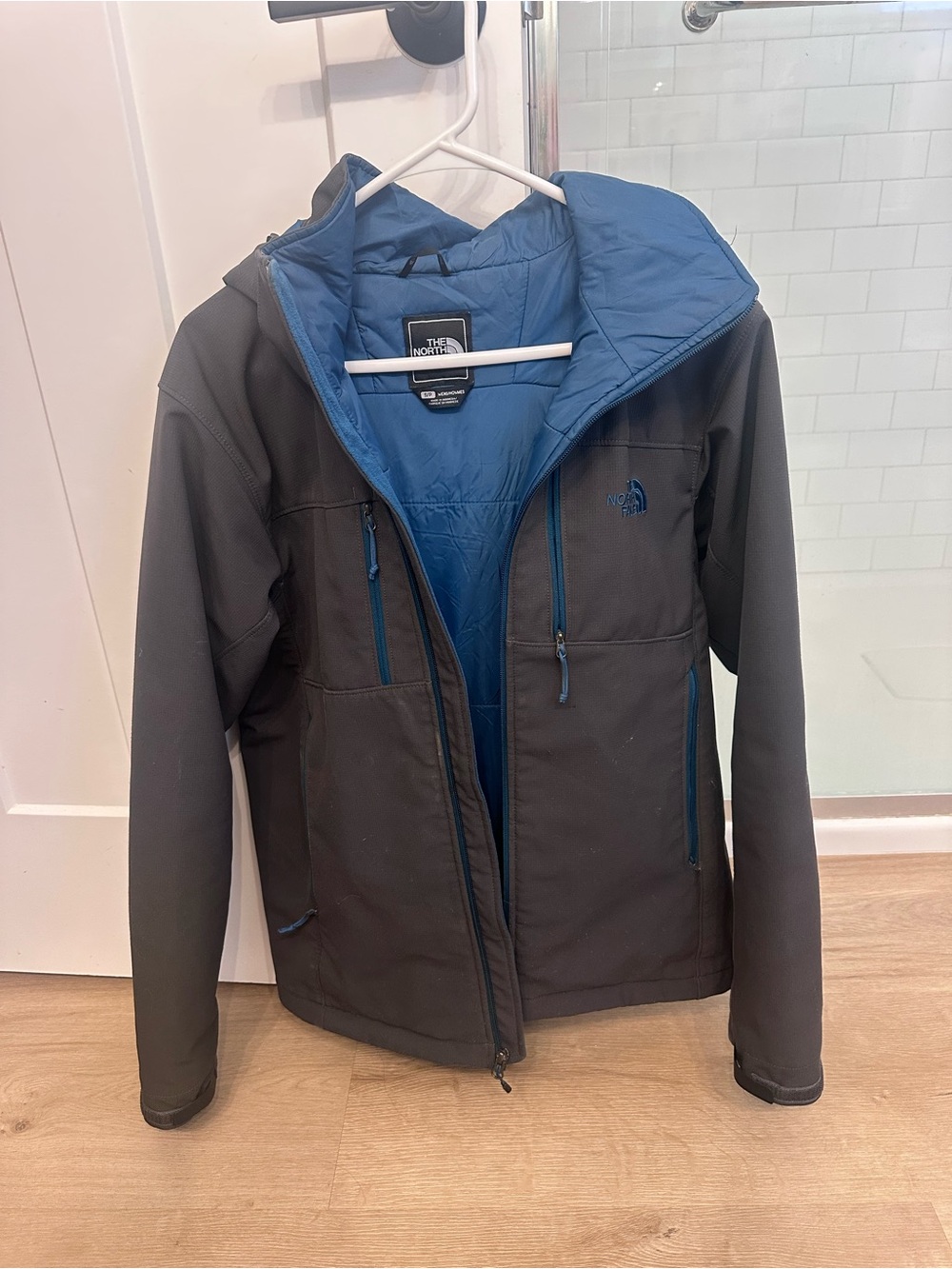 The North Face Men’s Black Softshell Coat with Blue Lining